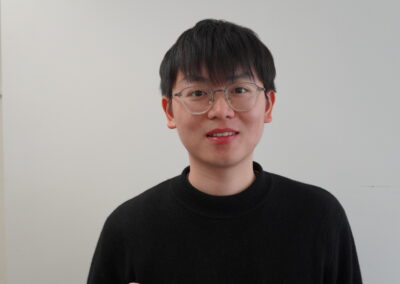 Balancing energy yield and turbine fatigue: a load-aware approach to wind farm layout optimization